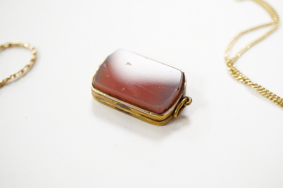 An 800 standard gilt white metal and garnet cluster set oval pendant, 18mm, on a 585 yellow metal fine link chain, 2.5 grams, a gilt white metal and garnet cluster set hinged bangle, two white metal brooches including on